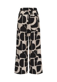 Pantalon à jambes larges avec taille élastique en tissu beige orné de formes géométriques abstraites noires et une poche plaquée à l'arrière.