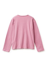 Hedvábná košile s dlouhými rukávy v měkké růžové bavlně, s kulatým výstřihem a spadlými rameny, nabízející volný střih a boční rozparky na lemu.