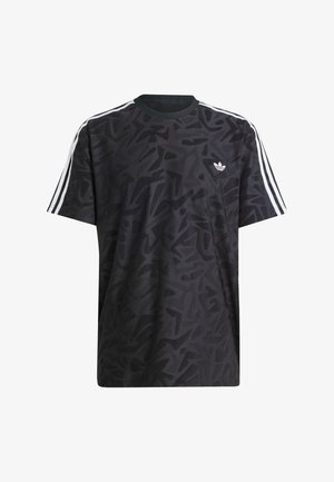 Melna kokvilnas T-kreklu ar abstraktu rakstu, īsām piedurknēm, apaļu kakla izgriezumu, trim baltām svītrām uz pleciem un mazu balto logotipu uz krūšu daļas.