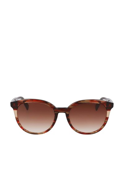 Tortoiseshell sunglasses with a rounded cat-eye shape, gradient brown lenses, and sleek metal accents on the temples.