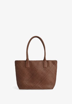 Pruunist punutud nahast rantkot, millel on kaks tugevat käepidet, ristkülikukujuline kuju ja tekstuuriga pind. Lihtne disain ja mitmekesised stiilid.