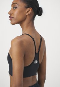 The North Face FLEX BRA - Športni modrček s srednjo podporo - black
