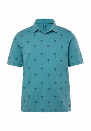 Turquoise polo shirt with a collar, featuring a repeated palm tree pattern in dark blue. Made from soft cotton, with short sleeves and a relaxed fit.