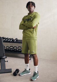 Puma SHORTS - Sportske kratke hlače - olive green