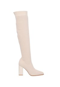 Botas de punto beige hasta la rodilla con un tacón bloque estructurado y punta afilada. La parte superior cuenta con un patrón texturizado y transpirable para mayor comodidad.