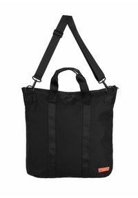 Black tote bag made of fabric with dual top handles and a detachable shoulder strap. Features a small tag with orange accent.