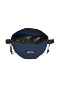 Borsetta in nylon blu navy con interno nero, chiusura superiore con zip, dettaglio con cordino e patch del logo Eastpak sul davanti.