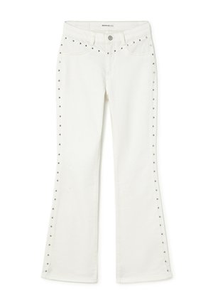 White flared jeans with metal stud detailing along pockets and outer seams, front button closure, and belt loops.