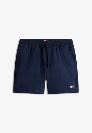 Granatowe męskie spodenki kąpielowe z elastycznym pasem, sznurkiem ściągającym, bocznymi kieszeniami oraz logo Tommy Jeans na lewej nogawce i pasie.