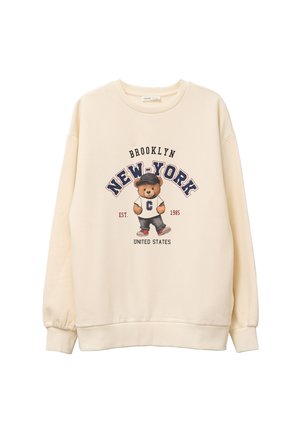 Cream sweatshirt featuring a bear graphic in a baseball cap, with "BROOKLYN" and "NEW-YORK" text in navy and red. Ribbed cuffs and hem.