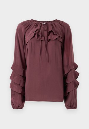 Bordoo pluus pika varrukatega, millel on kihilised volangid ja kogutud kaelus. Valmistatud kergest kangast, millel on kerge tekstuur.