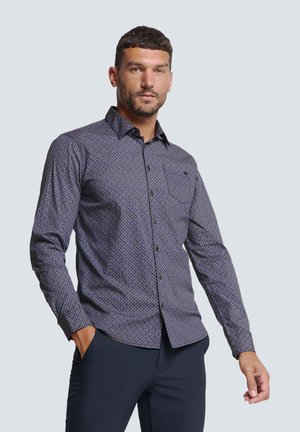 Mouwloze button-up shirt in marineblauw met een geometrisch patroon. Voorzien van een enkele borstzak en een gestructureerde kraag. Glad textuur.