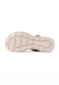 Suola della scarpa con una superficie testurizzata, caratterizzata da una combinazione di materiali beige chiaro e marrone scuro, progettata per offrire aderenza e supporto.