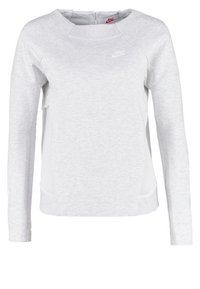 Ljusgrå sporttröja med rund hals, långa ärmar, sidopaneler i mesh och en liten vit Nike-logga på bröstet.