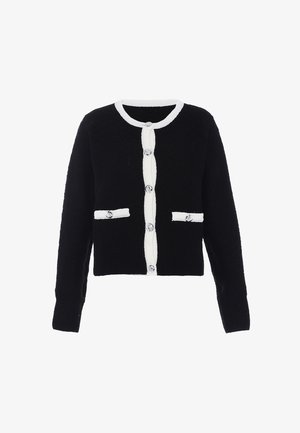 Juodas megztinis su balta apdaila, turintis apvalų iškirpimą, mygtukų uždarymą ir dvi priekinės kišenes su dekoratyviniais mygtukais.