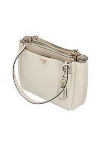 Sac à main en cuir couleur crème avec deux compartiments zippés, une bandoulière unique et une plaque logo triangulaire dorée à l'avant.