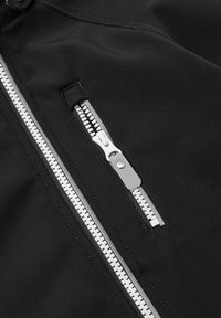 Black jacket fabric with a smooth texture featuring a prominent white zipper and an additional zippered pocket. Clean lines and minimal design.