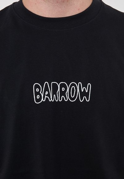 T-shirt in cotone nero con il logo "BARROW" bianco, arrotondato e in maiuscolo, sul davanti. Maniche corte e scollatura classica.
