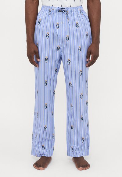 Lichtblauwe pyjamabroek met verticale witte strepen, voorzien van kleine, kleurrijke berenillustraties overal. Elastische tailleband met een trekkoord.