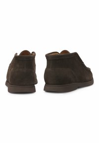 Brown suede ankle boots with a smooth texture, rounded toe, and dark rubber soles; features subtle stitching and brand logo on the back.