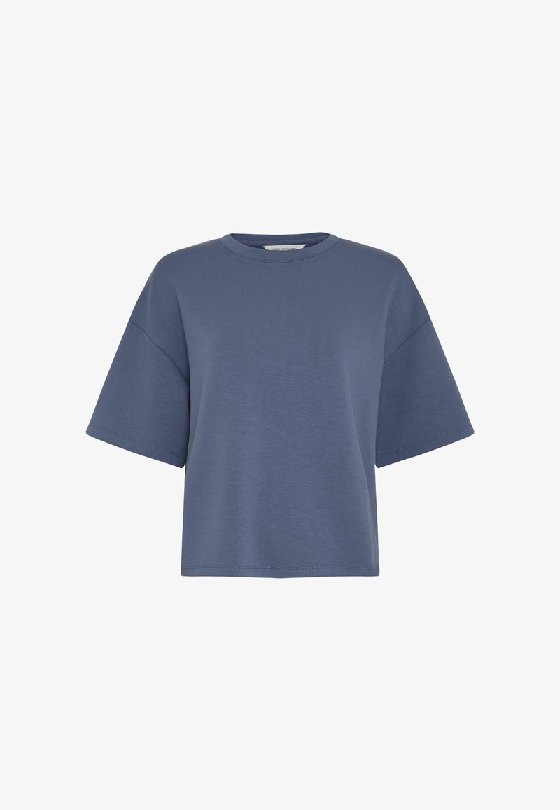 Μπλουζάκι μπλε, oversized με κοντό μανίκι, στρογγυλή λαιμόκοψη και χαλαρή εφαρμογή, εμφανίζεται σε απλό λευκό φόντο.
