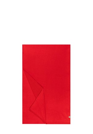 Red rectangular cloth made of smooth fabric, featuring a folded corner revealing its clean edges and minimalistic design.