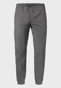 Graue Sporthose mit einem Kordelzugbund, Seitentaschen und tailliertem Design. Hergestellt aus leichtem, glattem Stoff. Dezentes Logo-Detail.