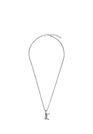 Silberne Halskette mit einem kleinen silbernen Anhänger in Form eines Haartrockners, der in der Mitte hängt.