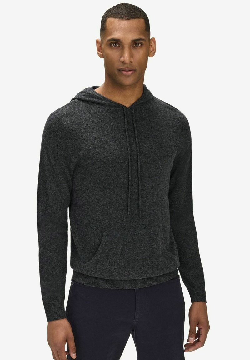 Mörkgrå hoodie gjord av mjukt tyg. Har en dragsko i huvan, ficka fram och ribbad nederkant. Avslappnad, ledig passform.