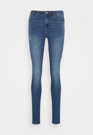 Smala jeans i mörkblå denim, med fem fickor, en knappstängning och subtila blekningspartier framtill för texturvariation.