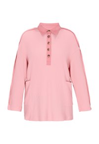 Felpa rosa chiaro con collo, patta con cinque bottoni, due tasche laterali e tessuto strutturato con maniche rilassate.