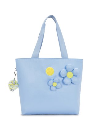 Lyseblå mulepose med to polstrede blå og gule blomster og et gult rundt logomærke, plus en lille stribet nøgleringscharme.
