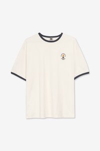 Cream cotton t-shirt with a navy ribbed collar and sleeve edges. Features a small printed design with a sailboat and stars on the chest.