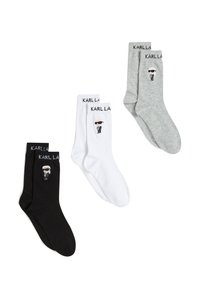 Tri páry ponožiek do členkov v čiernej, bielej a sivej farbe. Každá má na manžete vyšitú postavu a logo "KARLLA".