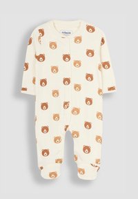 Cremefarbenes Baby-Overall mit einem wiederholten Muster aus braunen Bärenköpfen, langen Ärmeln und Druckknopfverschlüssen an der Vorderseite.