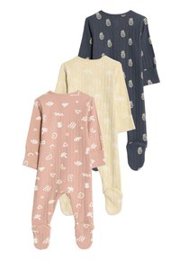Trois grenouillères pour bébé à manches longues : rose avec des motifs abstraits blancs, jaune avec des motifs floraux blancs, et bleu marine avec des ananas blancs.