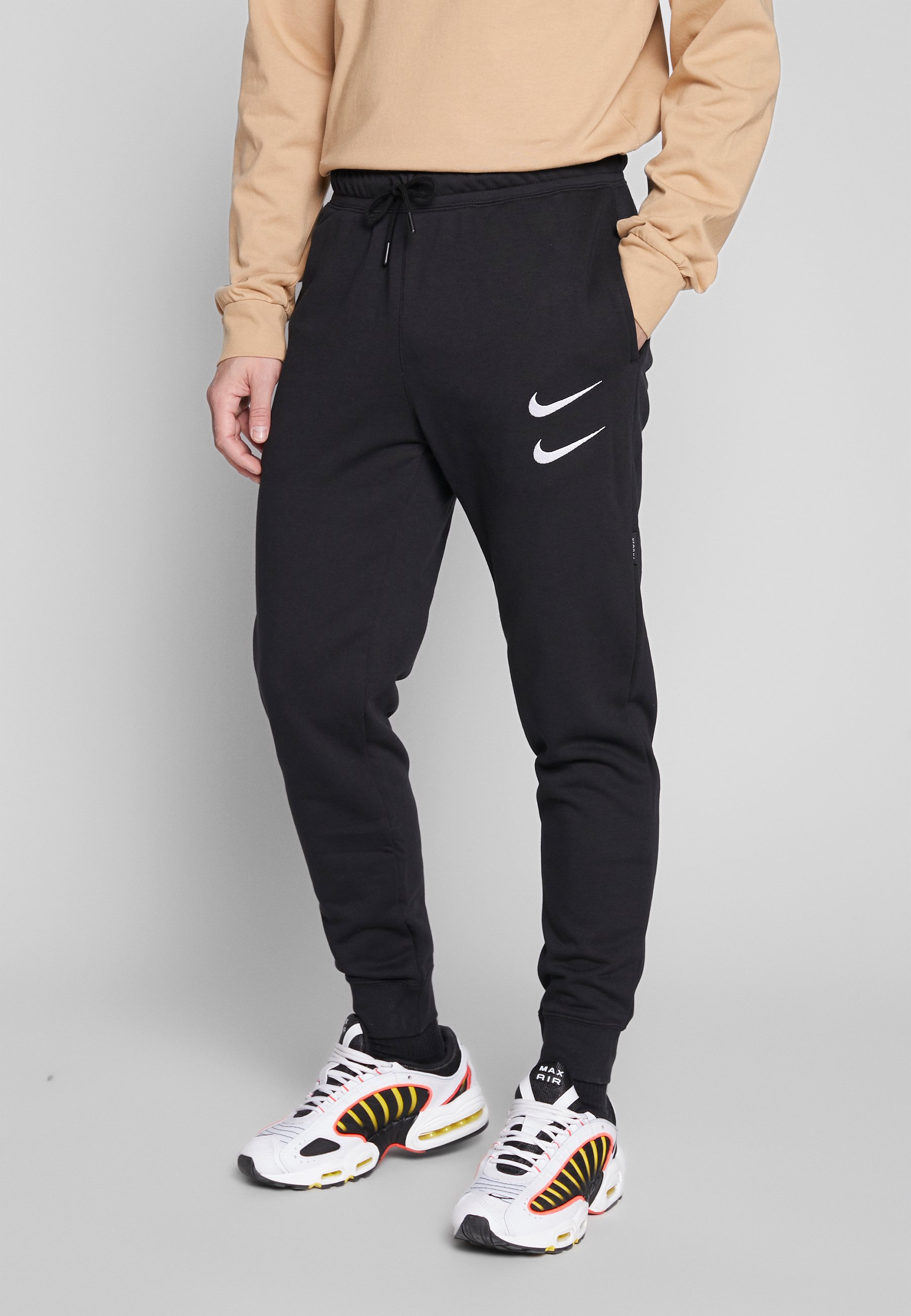 nike swoosh tracksuit white