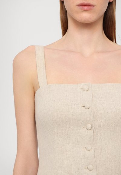 Beige linne tank topp med firkantet utringning, med fem knappelukkinger foran og brede skulderstropper.