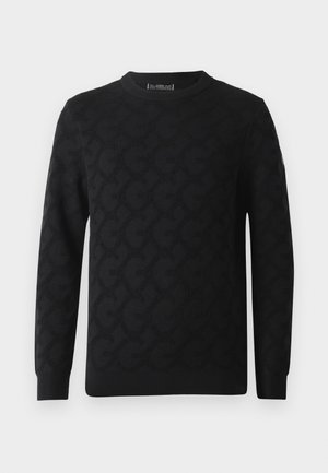 Pull noir à manches longues avec col rond, présentant un motif monogramme texturé subtil et des bords côtelés aux poignets et à l'ourlet.
