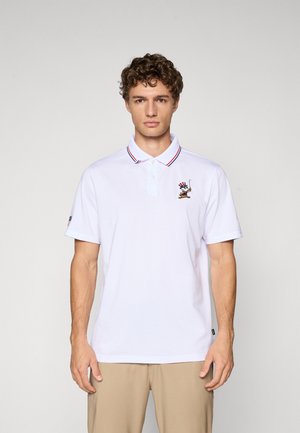 White polo shirt with red and blue striped collar, featuring an embroidered character design on the left chest, short sleeves, and a textured fabric.