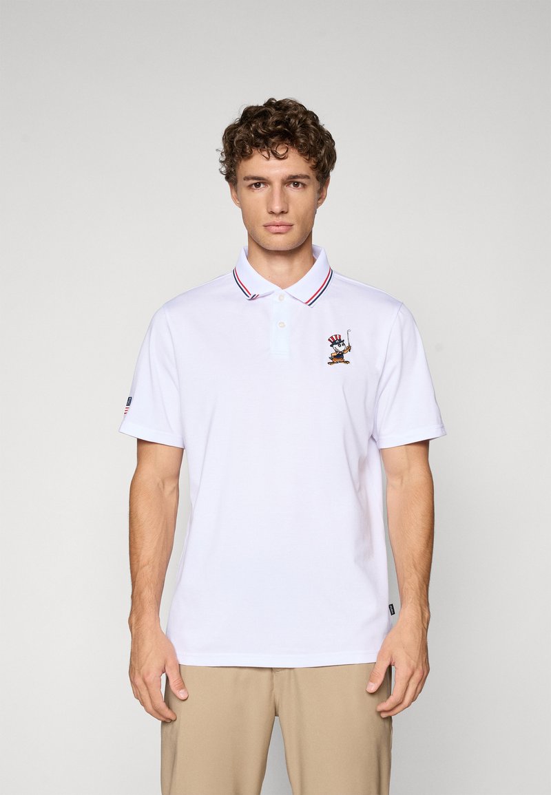 White polo shirt with red and blue striped collar, featuring an embroidered character design on the left chest, short sleeves, and a textured fabric.