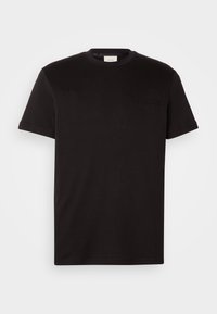 T-shirt noir à manches courtes avec col rond et logo Calvin Klein en relief subtil sur la poitrine gauche, présenté sur fond blanc.