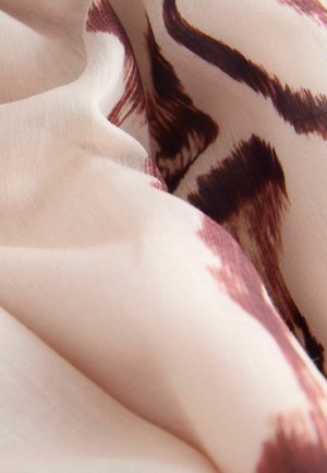 Könnyű anyag puha tapintással, bézs alappal és barna absztrakt mintákkal, áramló, réteges hajtásokban.