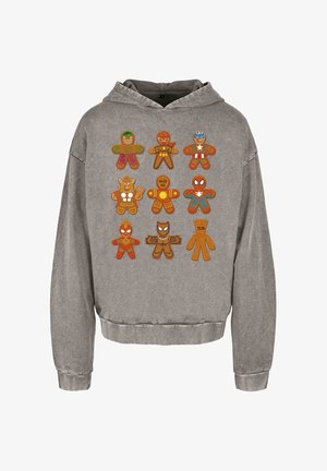 Šedá mikina s kapucí, na které jsou v kresleném stylu zobrazené postavy z perníku v různých superhrdinských designových variantách. Materiál vypadá jemně a má volnější střih.