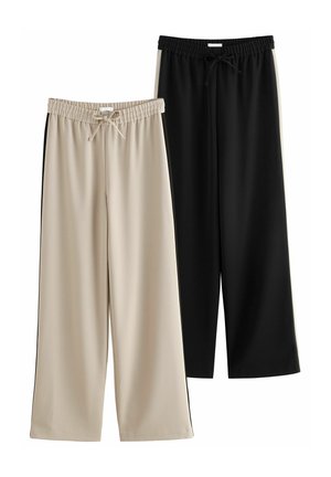 Två par vida byxor: en i beige med dragsko i midjan och den andra i svart. Båda har ett slätt, lätt tyg.