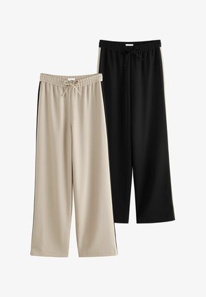 Kaks paari laia jala pükse: üks beež, millel on elastne vöökoht, ja teine must. Mõlemad on valmistatud siledast ja kergest kangast.