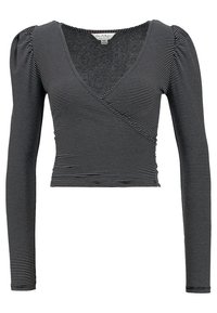 Svart- och vitrandig långärmad crop top med V-ringning och veckade ax seams, tillverkad av ett mjukt stretchtyg.