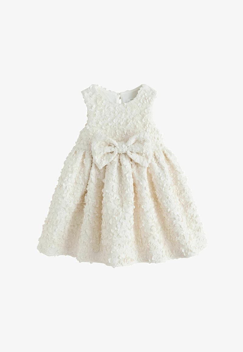 Ärmelloses Baby-Kleid in Elfenbein mit strukturiertem Blumenstoff und großer dekorativer Schleife in der Taille, gestaltet für besondere Anlässe.