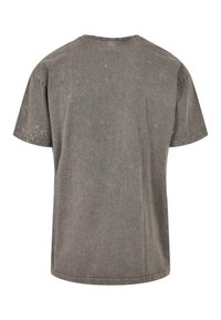 Graues Kurzarm-T-Shirt mit lockerer Passform, aus Baumwollstoff gefertigt. Verfügt über einen Rundhalsausschnitt und eine verblasste Textur mit einem abgenutzten Erscheinungsbild.