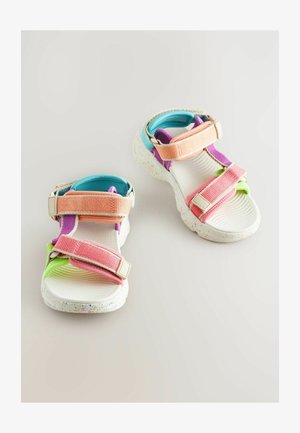 Barevné sandály s bílou texturovanou podešví, nastavitelné popruhy v růžové, oranžové, fialové a zelené barvě, a tečkovaná podrážka.